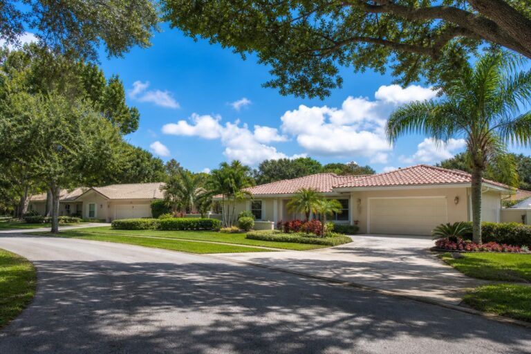 Ivanhoe Davie Florida single family ranch home with mature oak canopy and tropical groundcover representative of the 1986 to 1997 construction era