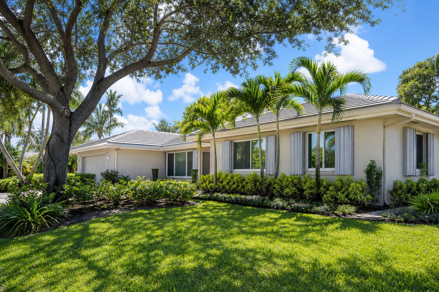 Davie Florida home with hurricane shutters and impact windows