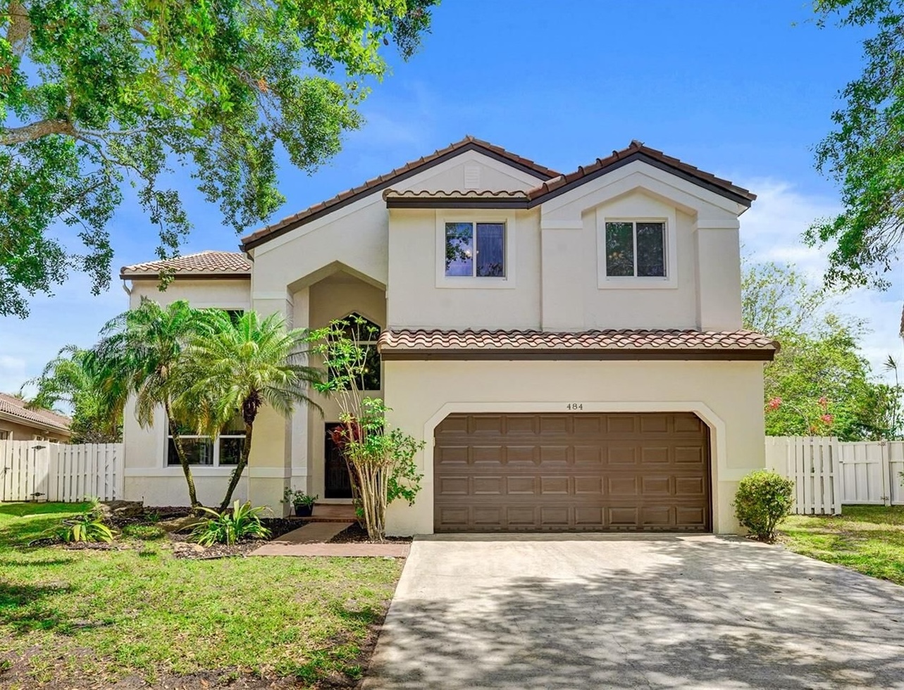 Suburban South Florida residential street showing the architectural variety between Weston planned communities and Davie ranch style homes 2026