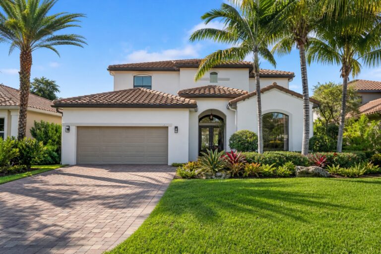 Representative two story single family home with manicured landscaping in the North Lakes community of Weston Florida