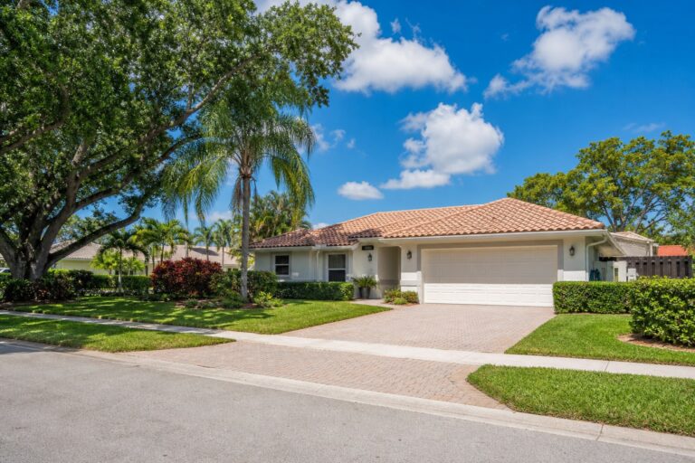 Davie Florida single family home that recently sold, with a tile roof, palm trees, and a paver driveway, representing a seller calculating net proceeds in 2026
