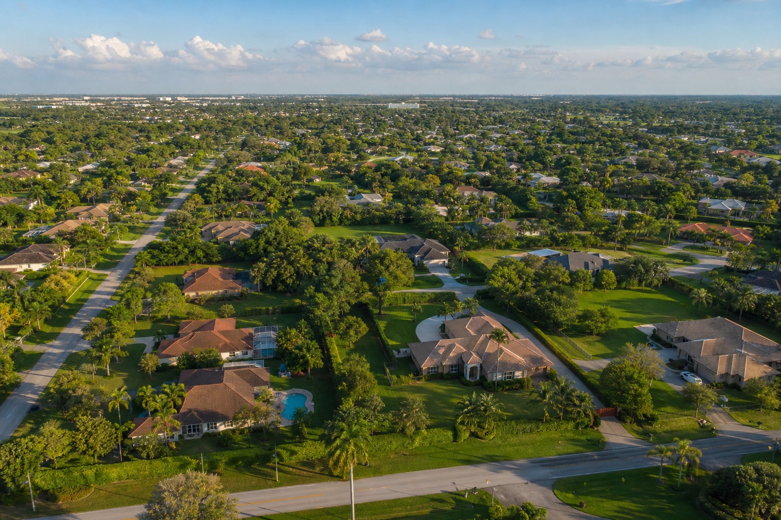 Aerial view of single family homes on large lots in Davie Florida next to a planned Cooper City neighborhood