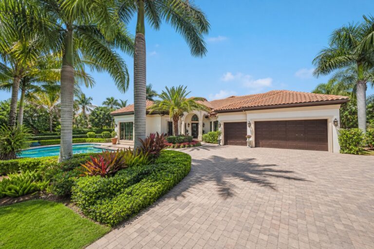 Representative single story pool home with a three car garage and mature landscaping in The Islands of Weston Florida, illustrating the style of 1640 Island Way