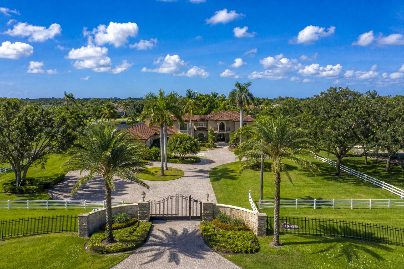Luxury estate home behind a gated entrance in western Davie Florida where the market above 1.5 million is outperforming the middle market in 2026