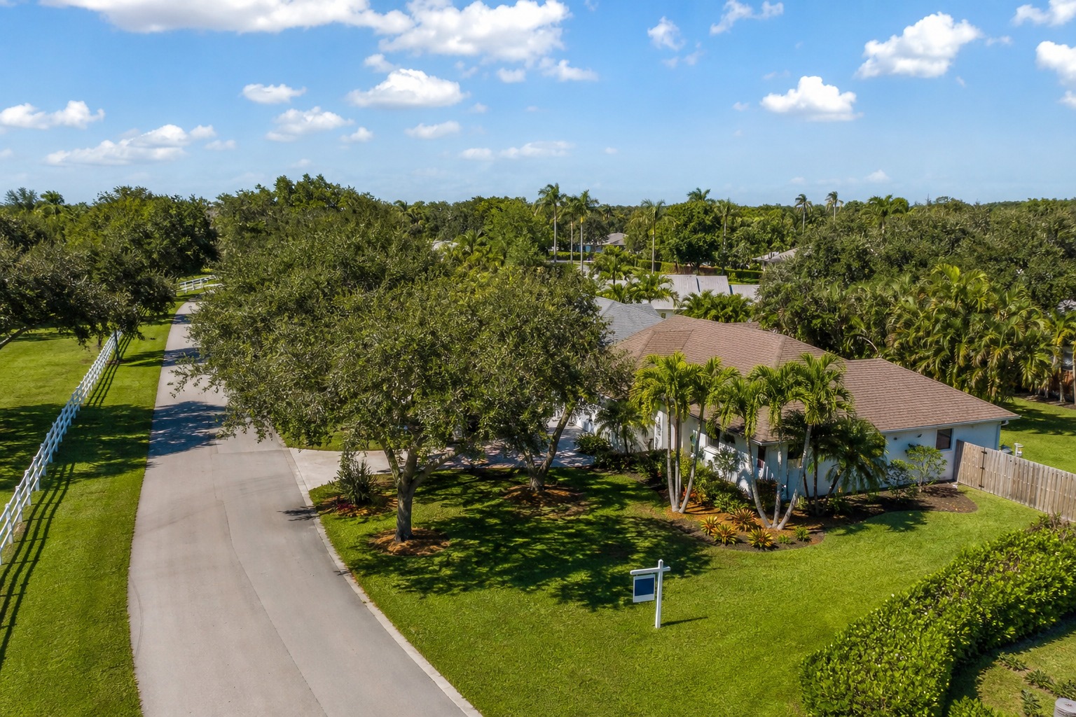 how to choose a mortgage lender davie fl neighborhood 1 Davie Florida residential street with ranch style homes and For Sale sign relevant to choosing a mortgage lender for a Davie home purchase 2026