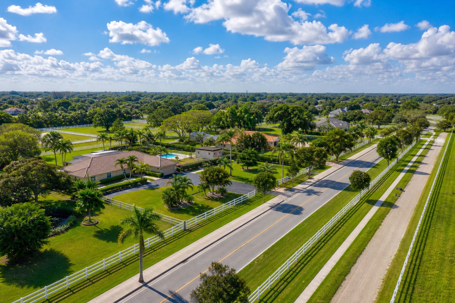 davie home value zillow vs mls aerial 1 Aerial view of Davie Florida single family homes with palm and oak canopy showing the neighborhoods behind the Davie home value and Zillow versus MLS question 2026